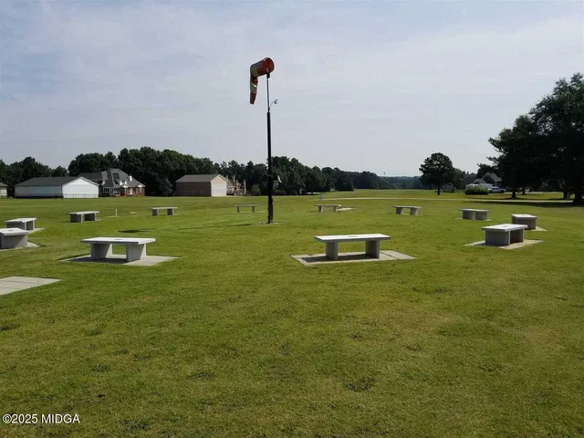 a view of a golf course with a lake view