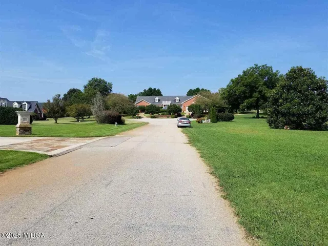 a backyard with a garden and entertaining space