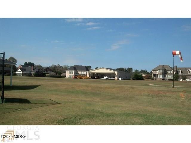 0 Mallard Lane Locust Grove, GA 30248 - Photo 7 of 27 a black and white photo of a lake