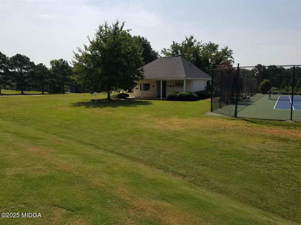 0 Mallard Lane Locust Grove, GA 30248 - Photo 8 of 27 a front view of a house with a garden