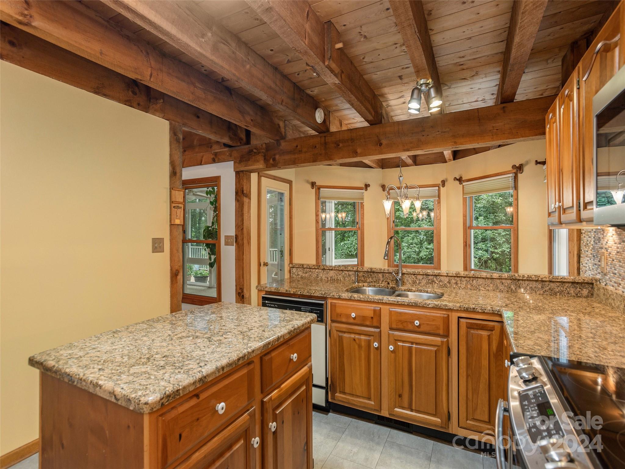 28 Chestnut Ridge Road, Unit 228 Mills River, NC 28759 - Photo 13 of 48 a bathroom with a granite countertop sink and a mirror