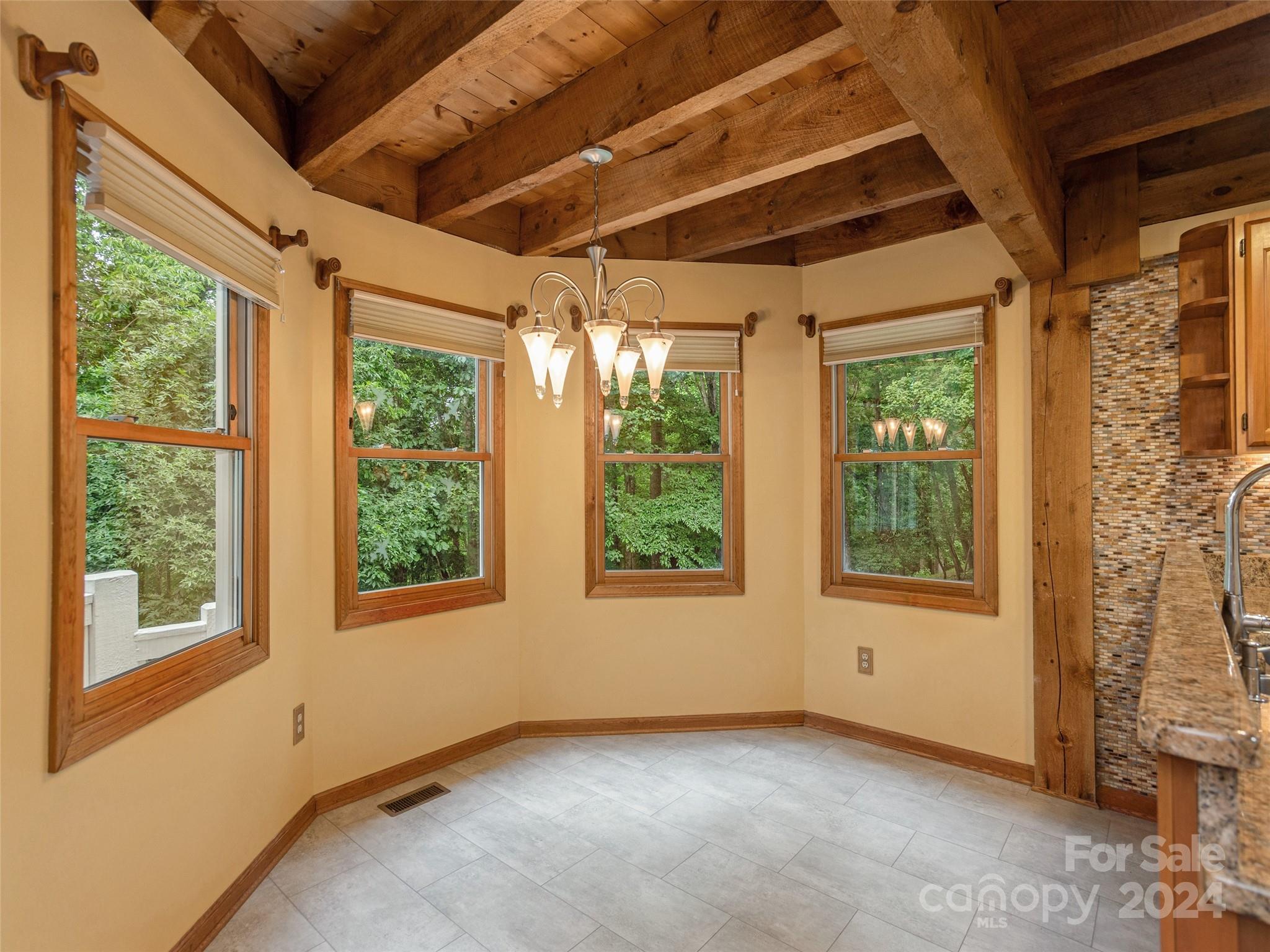 28 Chestnut Ridge Road, Unit 228 Mills River, NC 28759 - Photo 14 of 48 a view of an empty room with a window