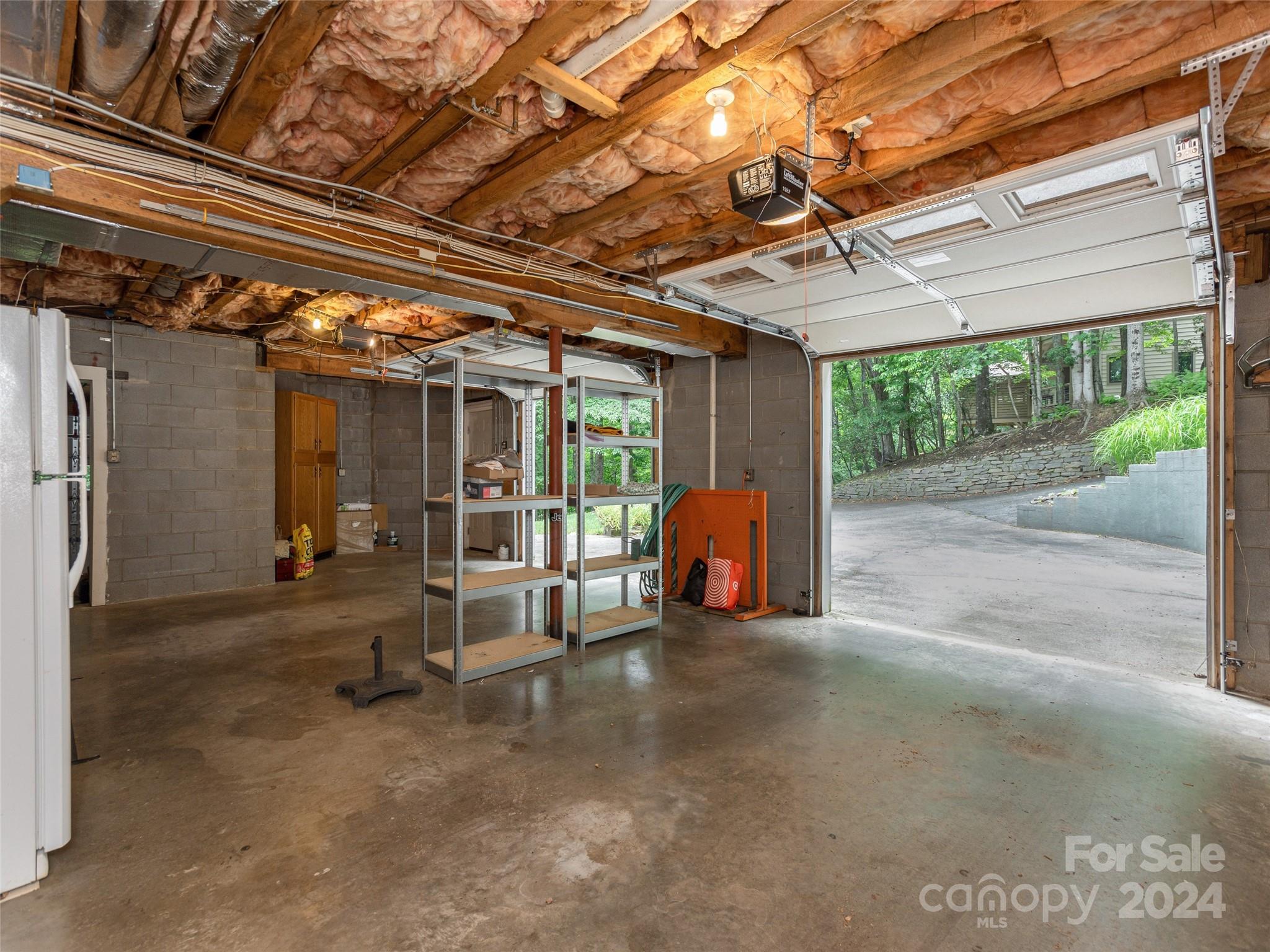 28 Chestnut Ridge Road, Unit 228 Mills River, NC 28759 - Photo 30 of 48 a view of a room with wooden walls
