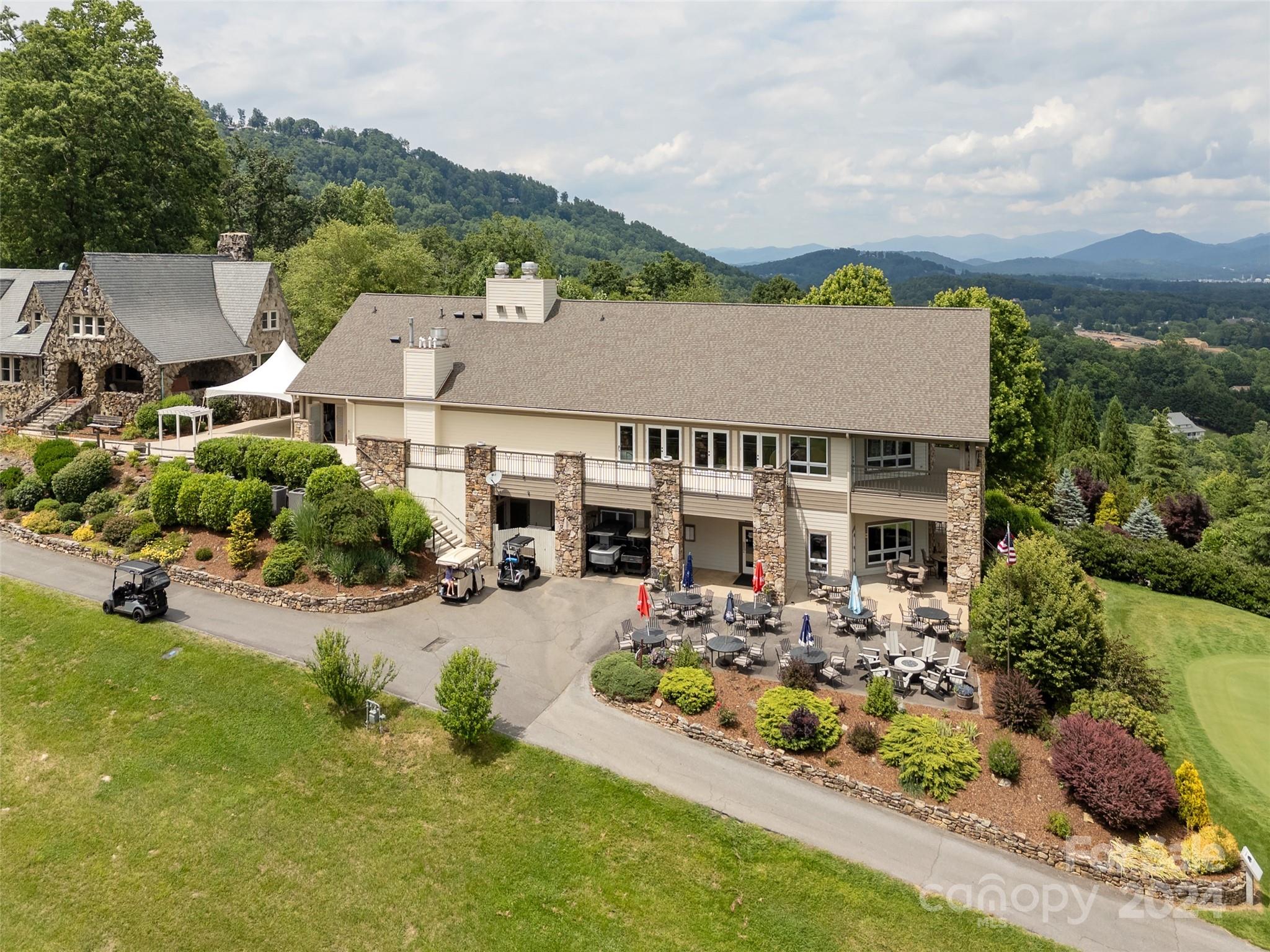 28 Chestnut Ridge Road, Unit 228 Mills River, NC 28759 - Photo 42 of 48 an aerial view of a house with garden space and houses view