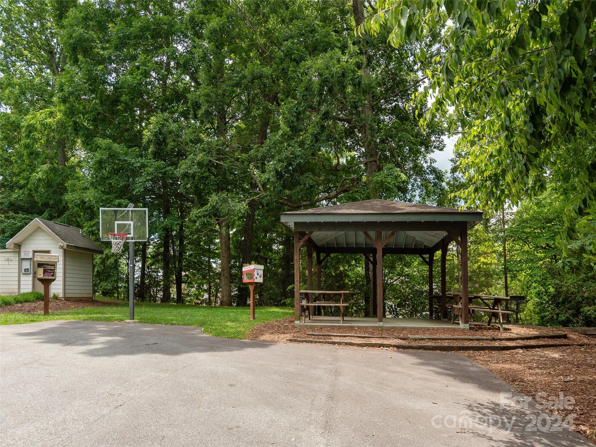 28 Chestnut Ridge Road, Unit 228 Mills River, NC 28759 - Photo 47 of 48 a view of a house with a yard and balcony