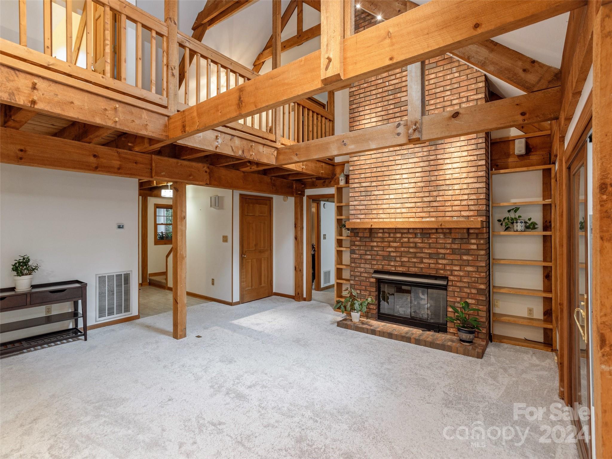 28 Chestnut Ridge Road, Unit 228 Mills River, NC 28759 - Photo 8 of 48 a view of a livingroom with an empty space and a fireplace