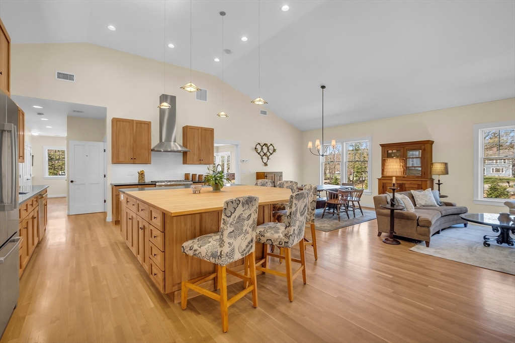 17 Whitney Road Stow, MA 01775 - Photo 12 of 42 a large kitchen with a table and chairs