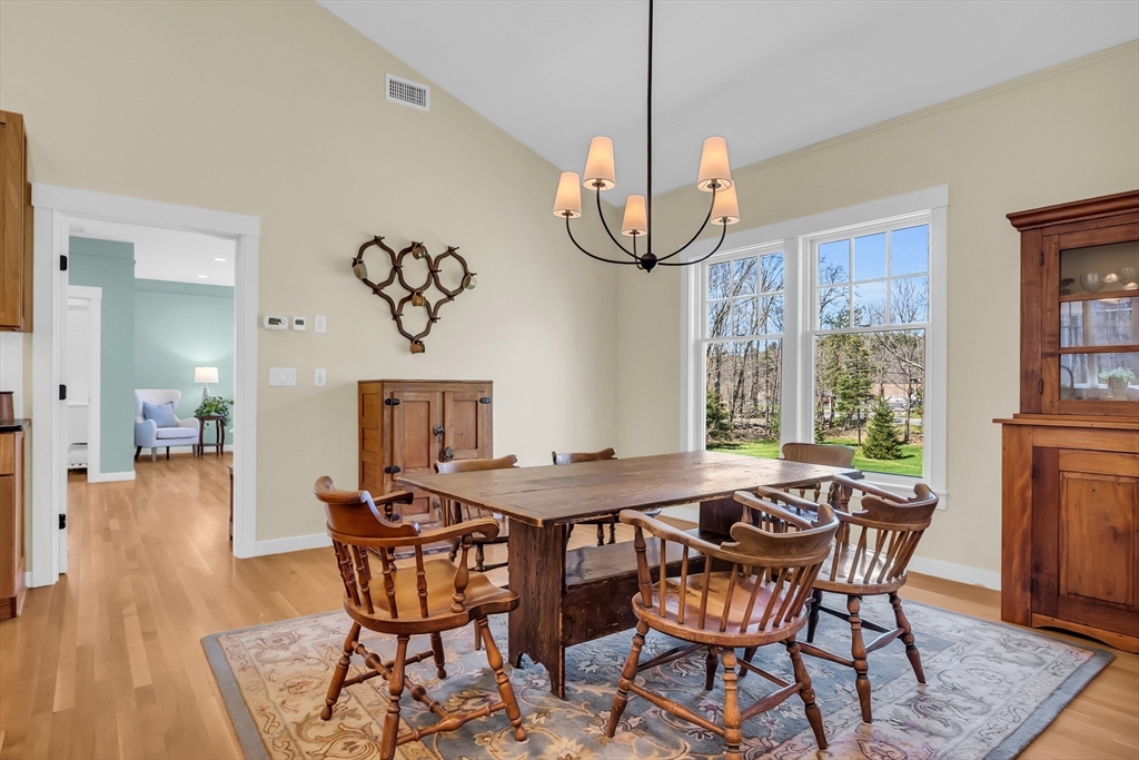17 Whitney Road Stow, MA 01775 - Photo 17 of 42 a view of a dining room with furniture window and wooden floor