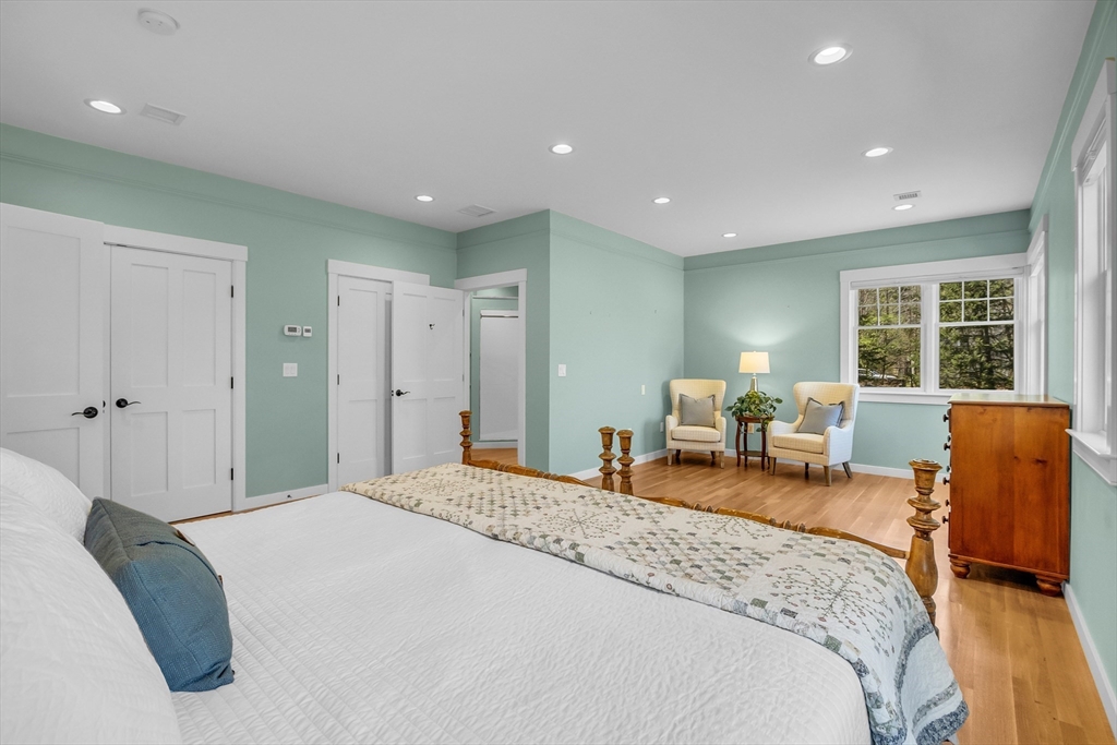 17 Whitney Road Stow, MA 01775 - Photo 21 of 42 a spacious bedroom with a large bed and a couch
