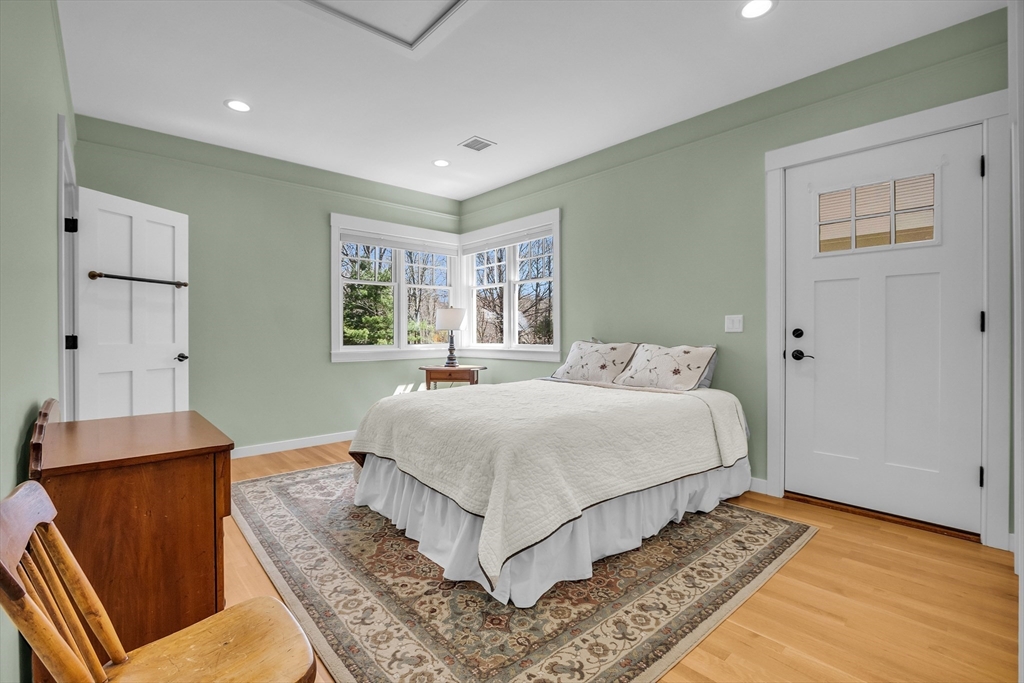 17 Whitney Road Stow, MA 01775 - Photo 24 of 42 a bedroom with a bed and wooden floor