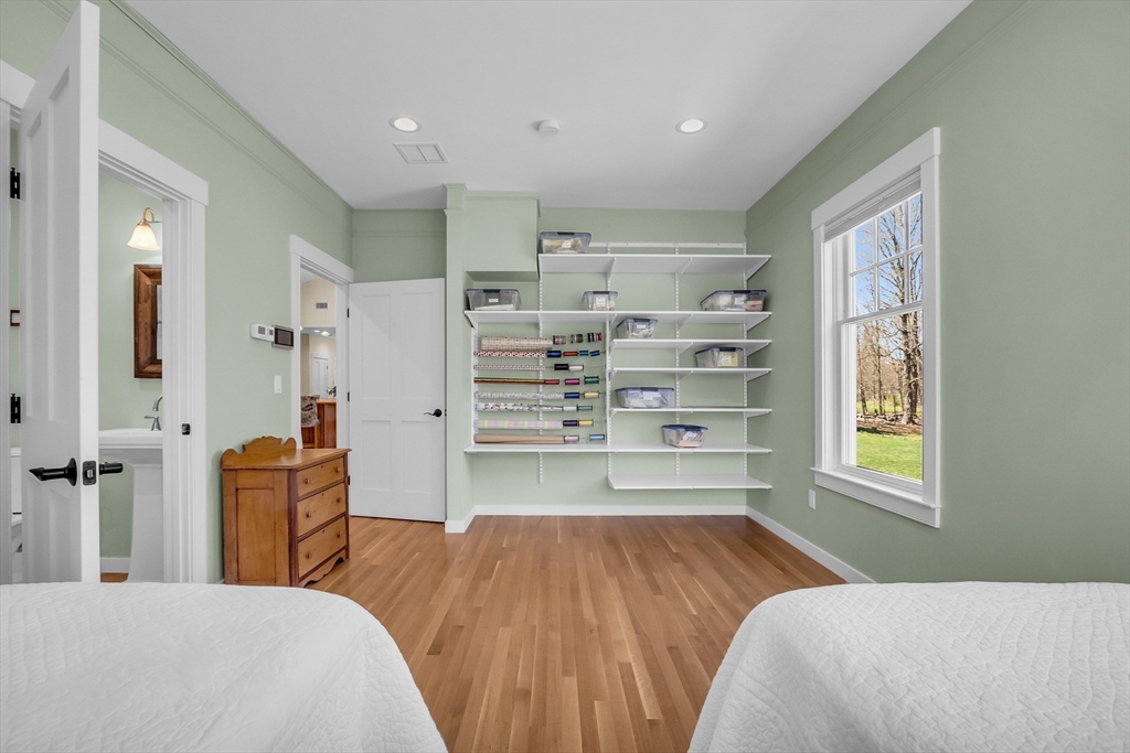 17 Whitney Road Stow, MA 01775 - Photo 27 of 42 a bedroom with a bed and a cabinets