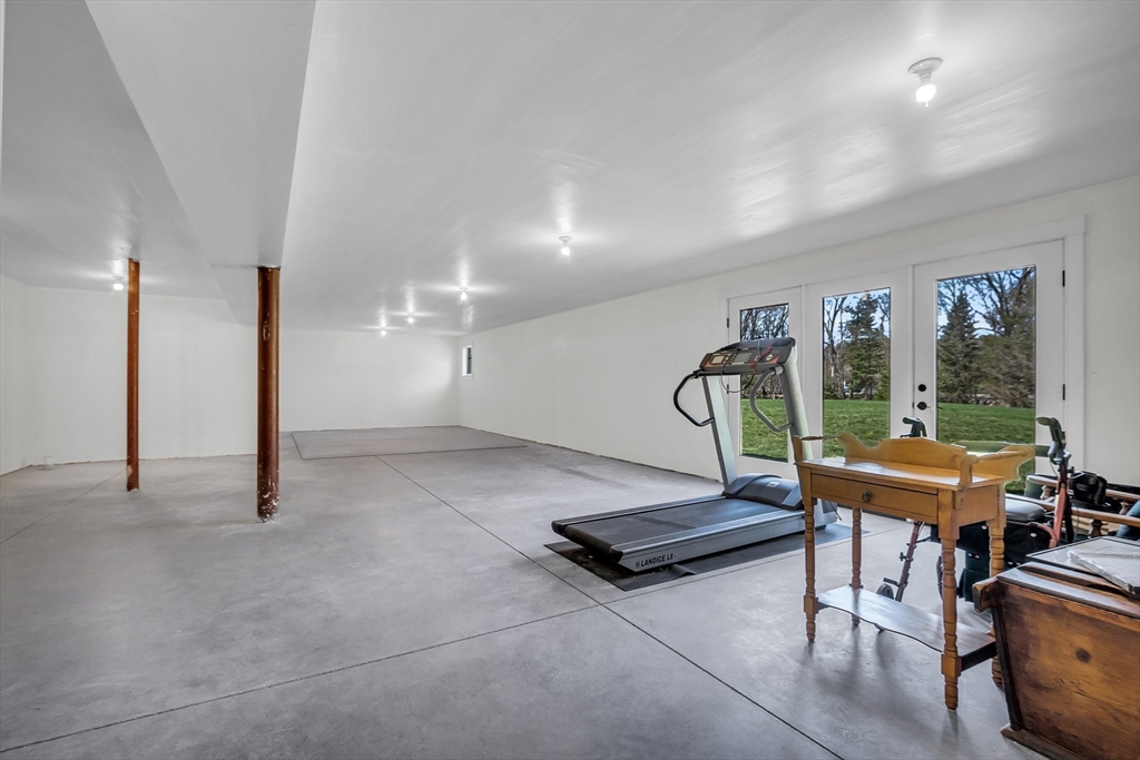 17 Whitney Road Stow, MA 01775 - Photo 34 of 42 a room with gym equipment and wooden floor
