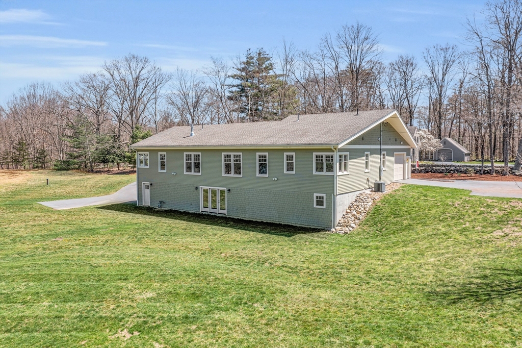 17 Whitney Road Stow, MA 01775 - Photo 41 of 42 a view of a house with garden and trees