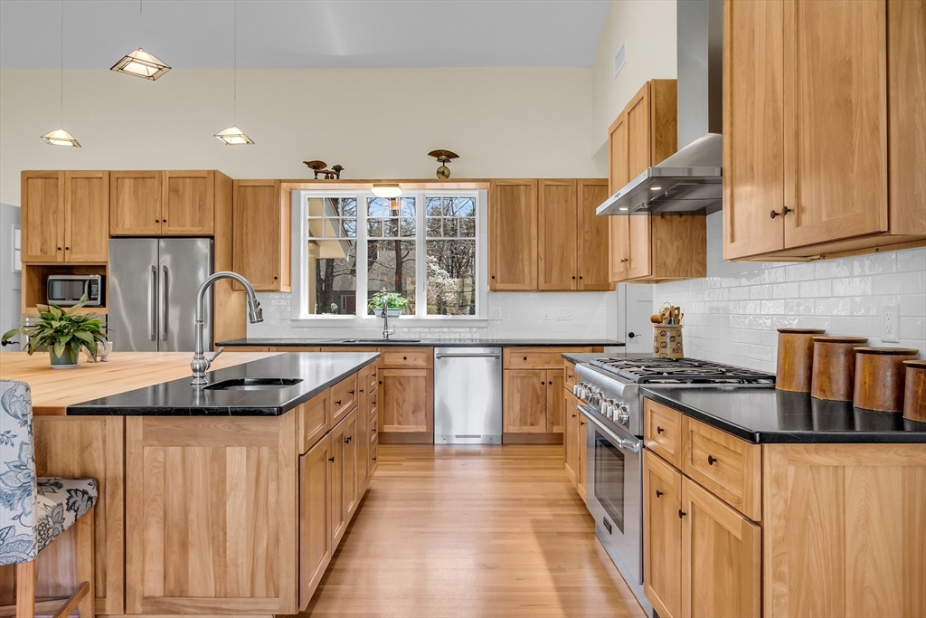 17 Whitney Road Stow, MA 01775 - Photo 6 of 42 a kitchen with stainless steel appliances granite countertop a sink and cabinets