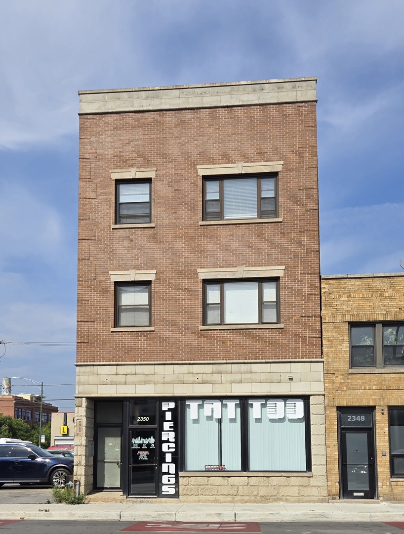2350 West Grand Avenue Chicago, IL 60612 - Photo 1 of 8 a front view of building with car parked
