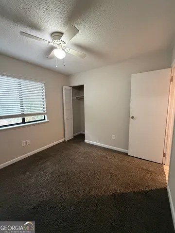 a view of an empty walk in closet