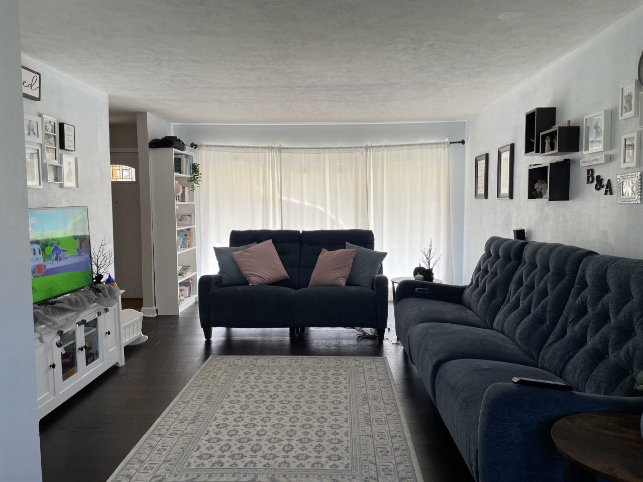 4812 Highcrest Road Rockford, IL 61107 - Photo 3 of 28 a living room with furniture and a couch
