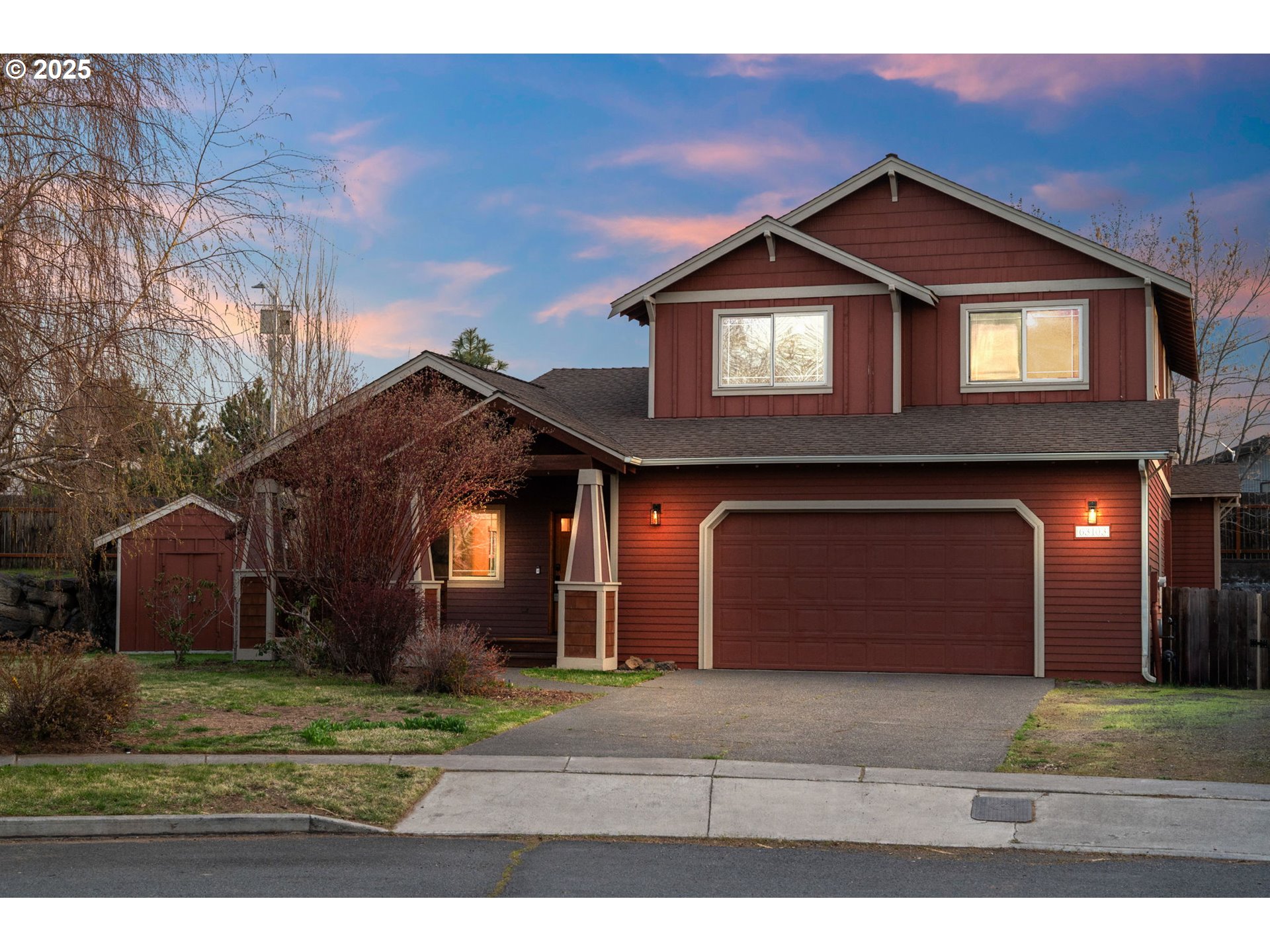 63103 Watercress Way Bend, OR 97701 - Photo 1 of 47 a front view of a house with a yard and garage