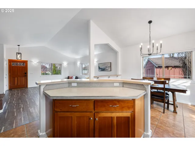 a view living room with kitchen island dining table and chairs