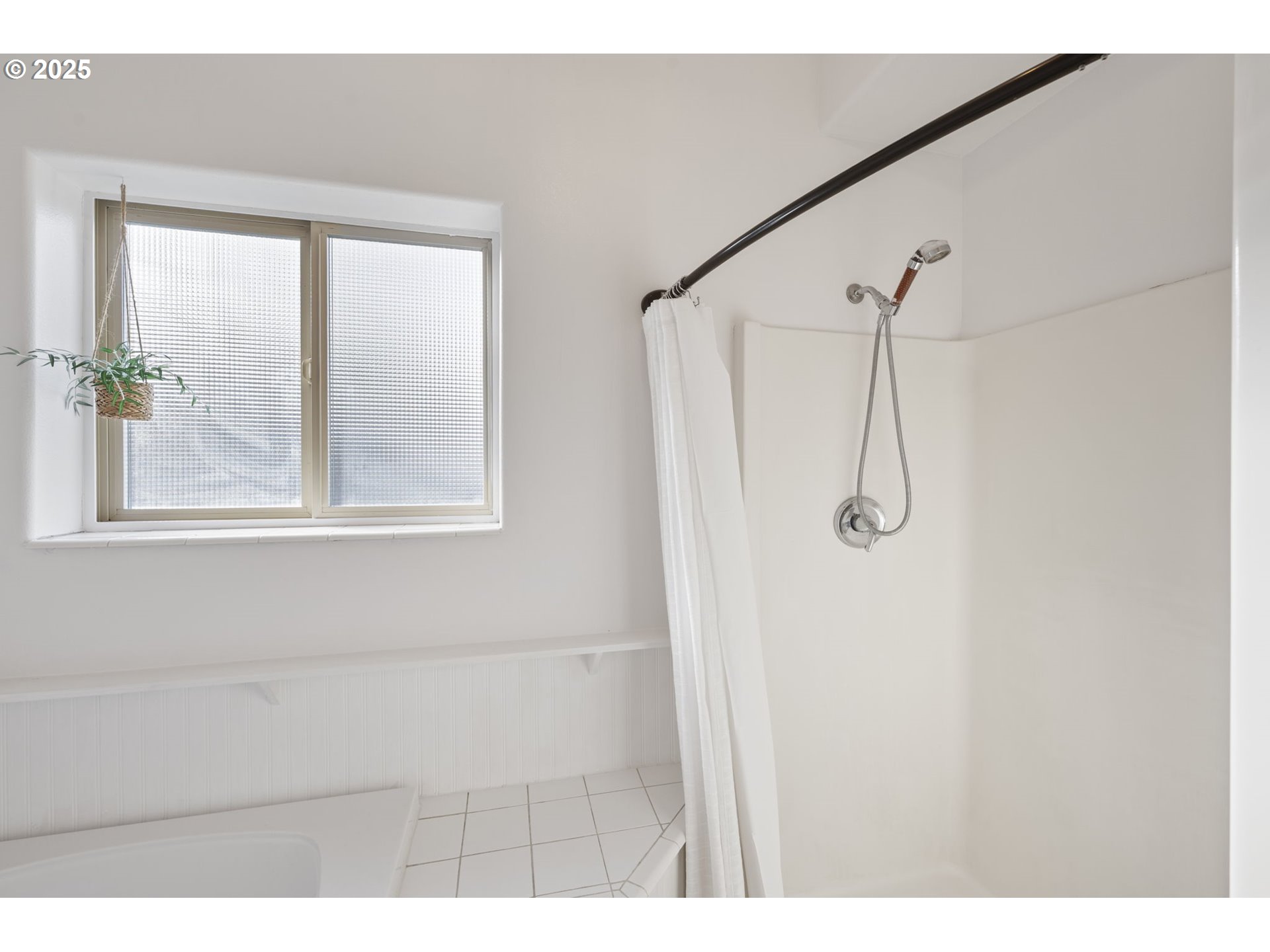 63103 Watercress Way Bend, OR 97701 - Photo 17 of 47 a bathroom with a shower and a window