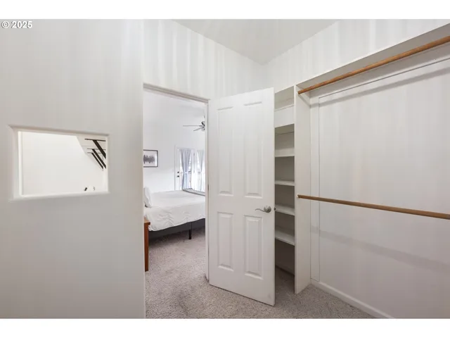 a bedroom with a bed and a view of bathroom