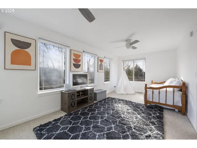 a living room with a couch and a window