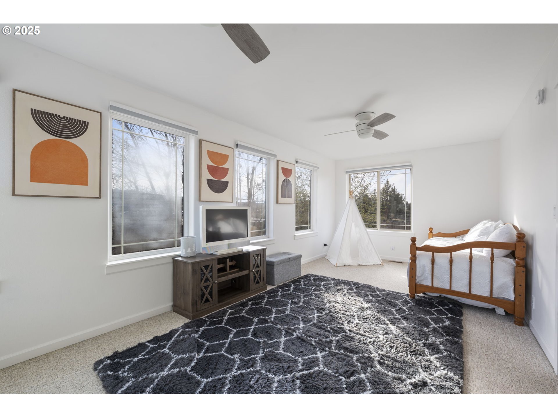 63103 Watercress Way Bend, OR 97701 - Photo 26 of 47 a living room with a couch and a window