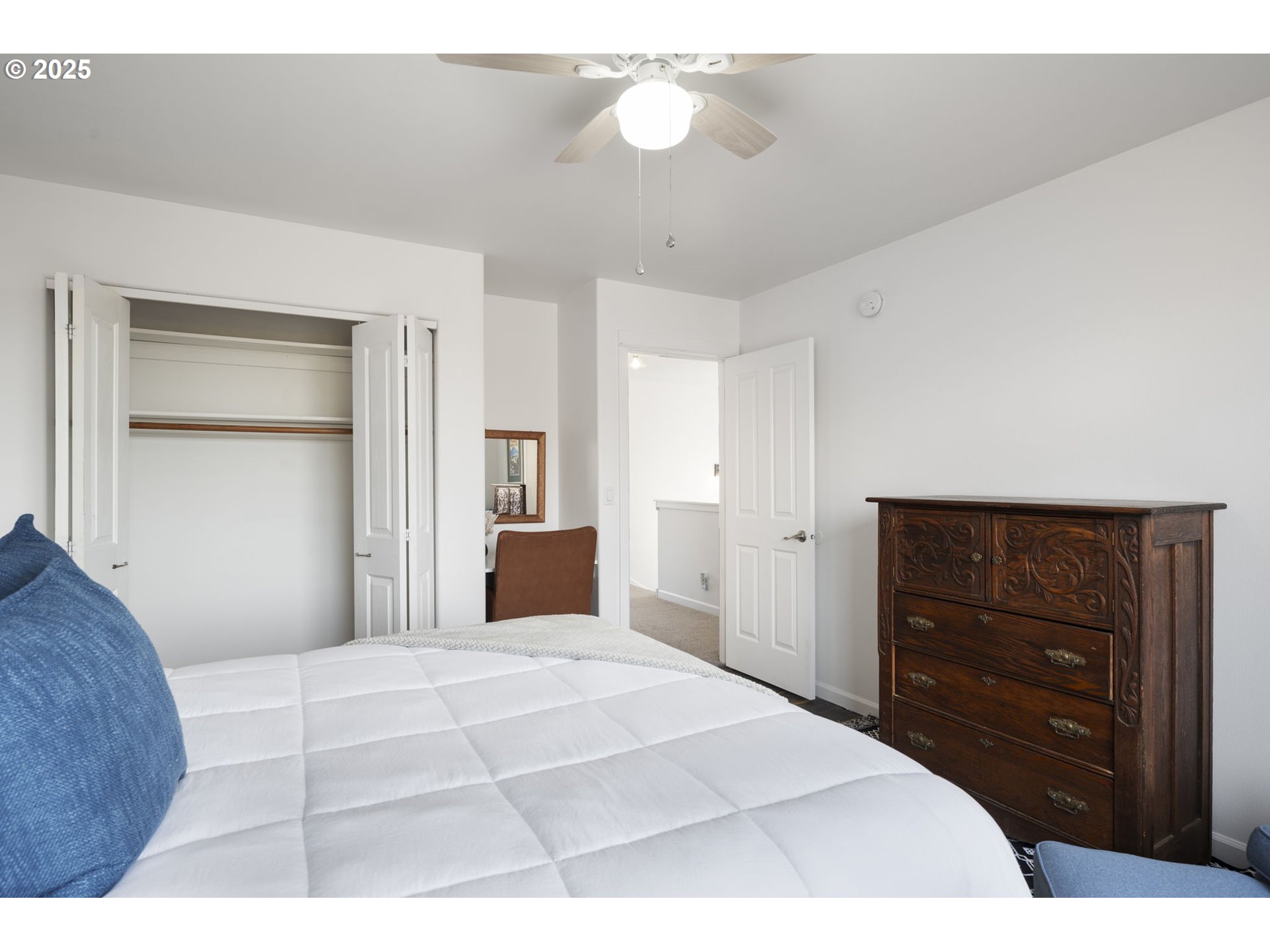 63103 Watercress Way Bend, OR 97701 - Photo 30 of 47 a bedroom with a bed and a dresser