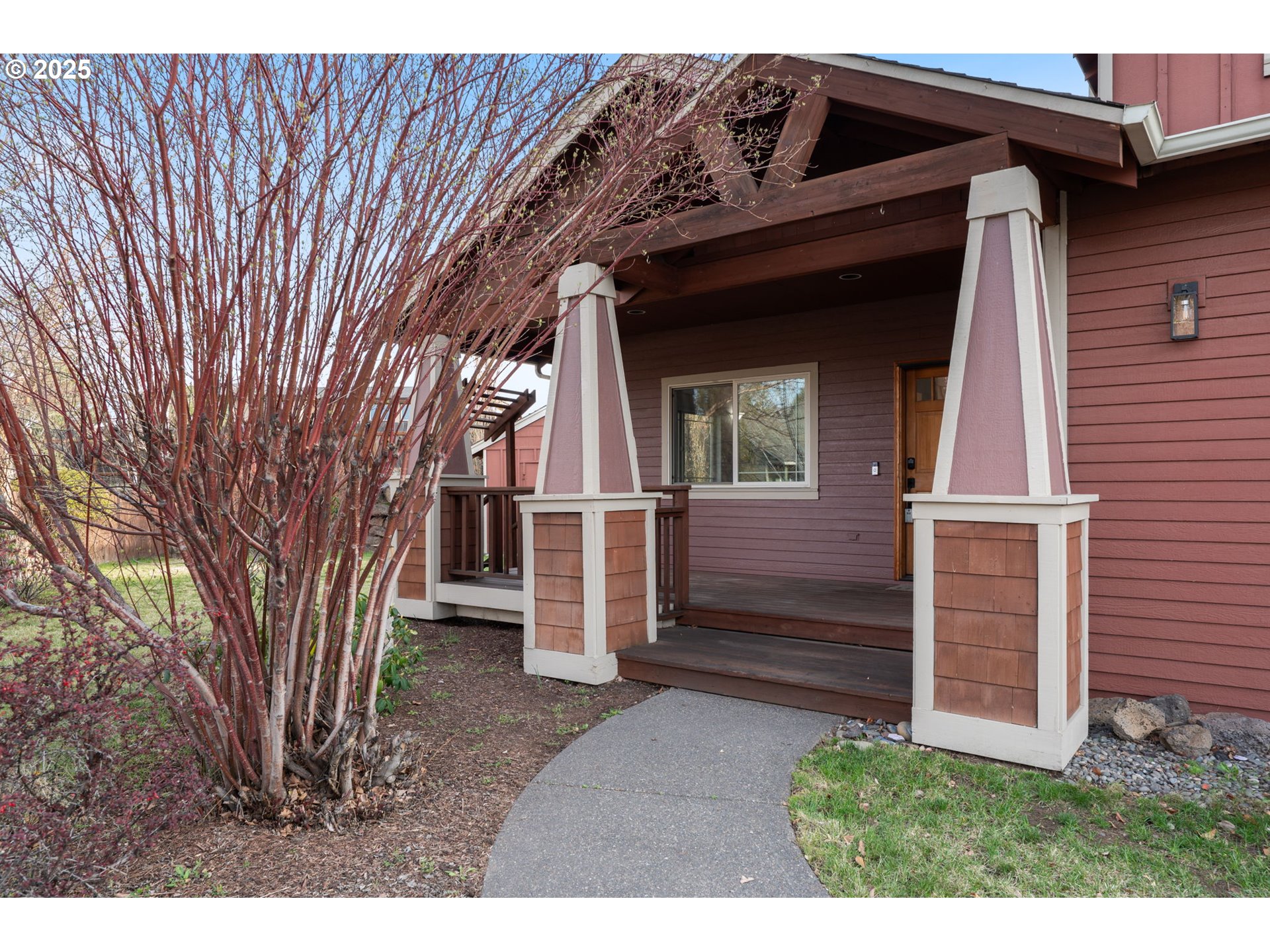 63103 Watercress Way Bend, OR 97701 - Photo 3 of 47 a view of a house with a large window and wooden fence