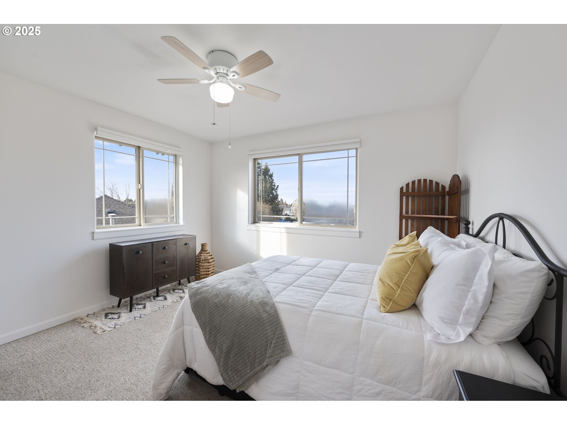 63103 Watercress Way Bend, OR 97701 - Photo 31 of 47 a bedroom with a bed and window