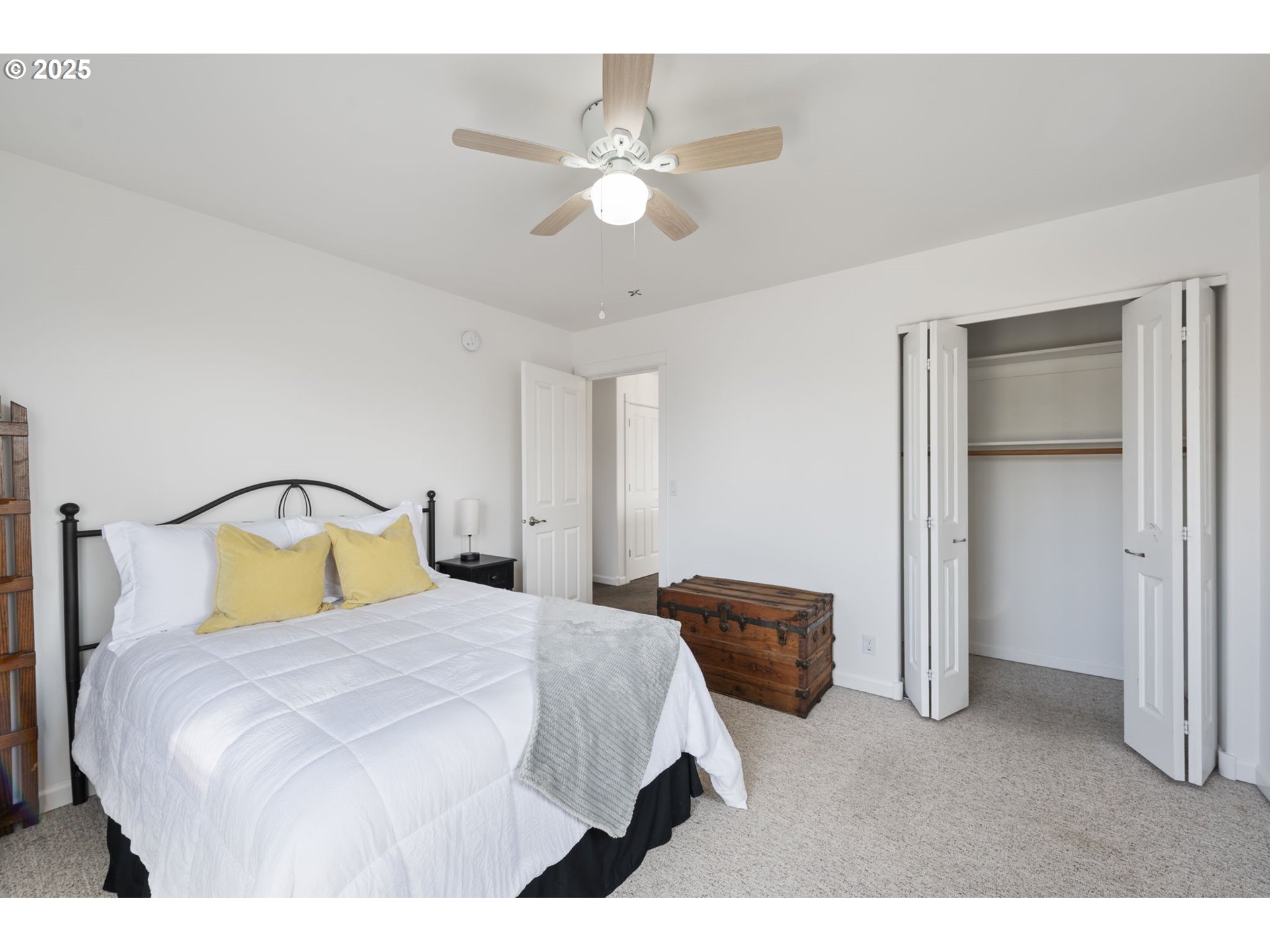 63103 Watercress Way Bend, OR 97701 - Photo 32 of 47 a bedroom with a bed and a ceiling fan