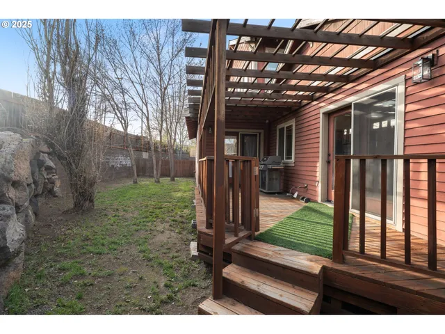 a backyard of a house with lots of green space