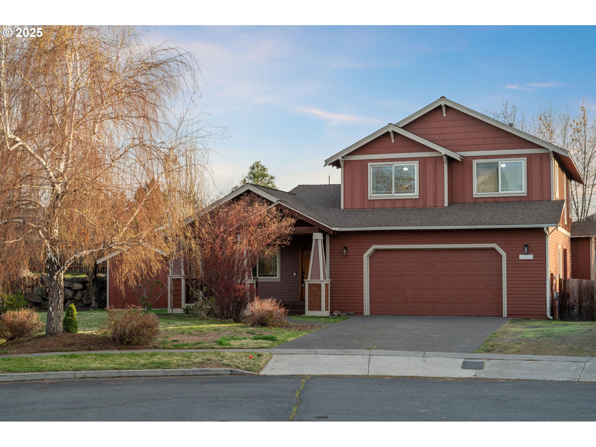 63103 Watercress Way Bend, OR 97701 - Photo 45 of 47 a front view of a house with a yard and garage