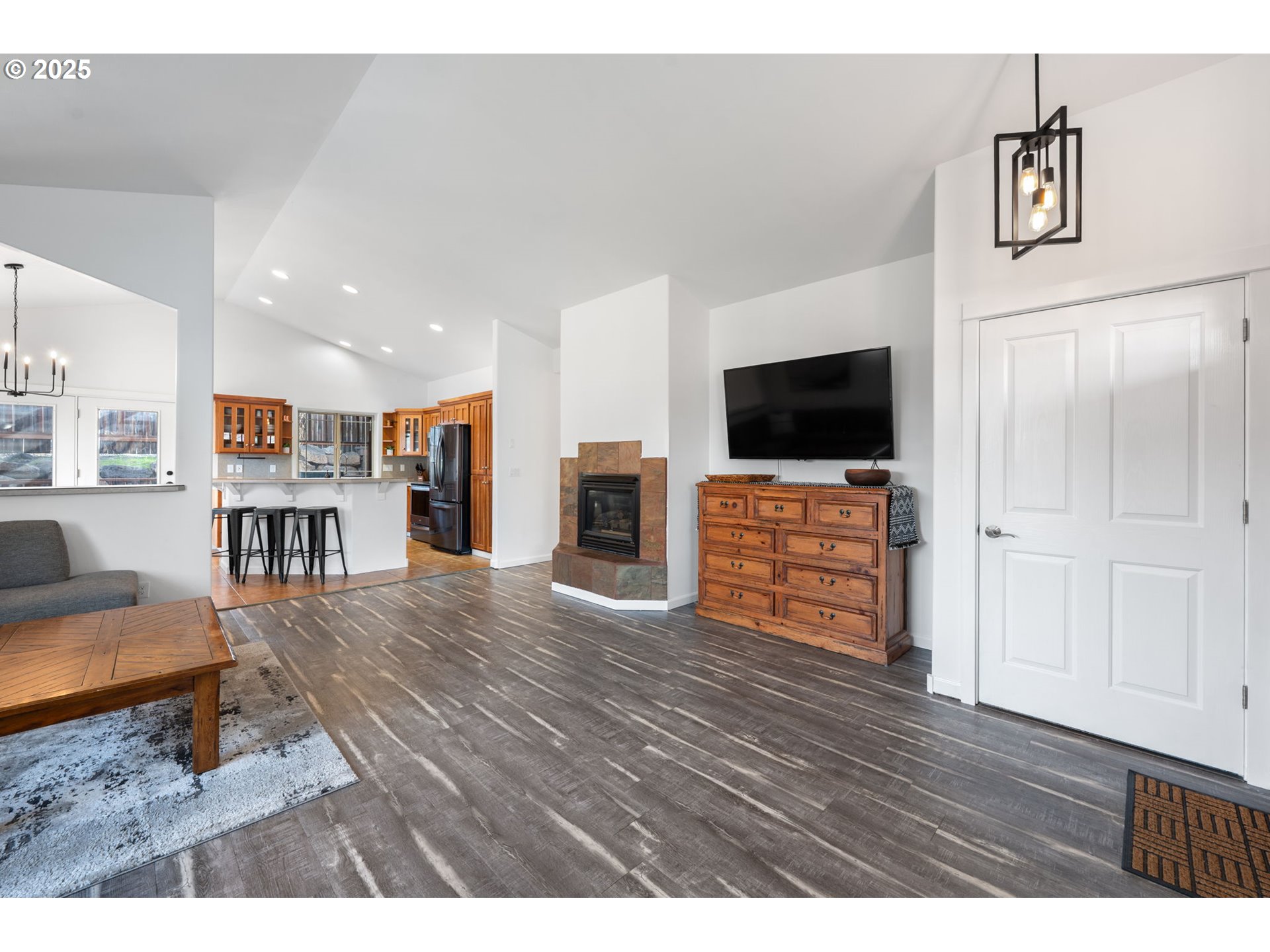 63103 Watercress Way Bend, OR 97701 - Photo 5 of 47 a living room with furniture and a flat screen tv