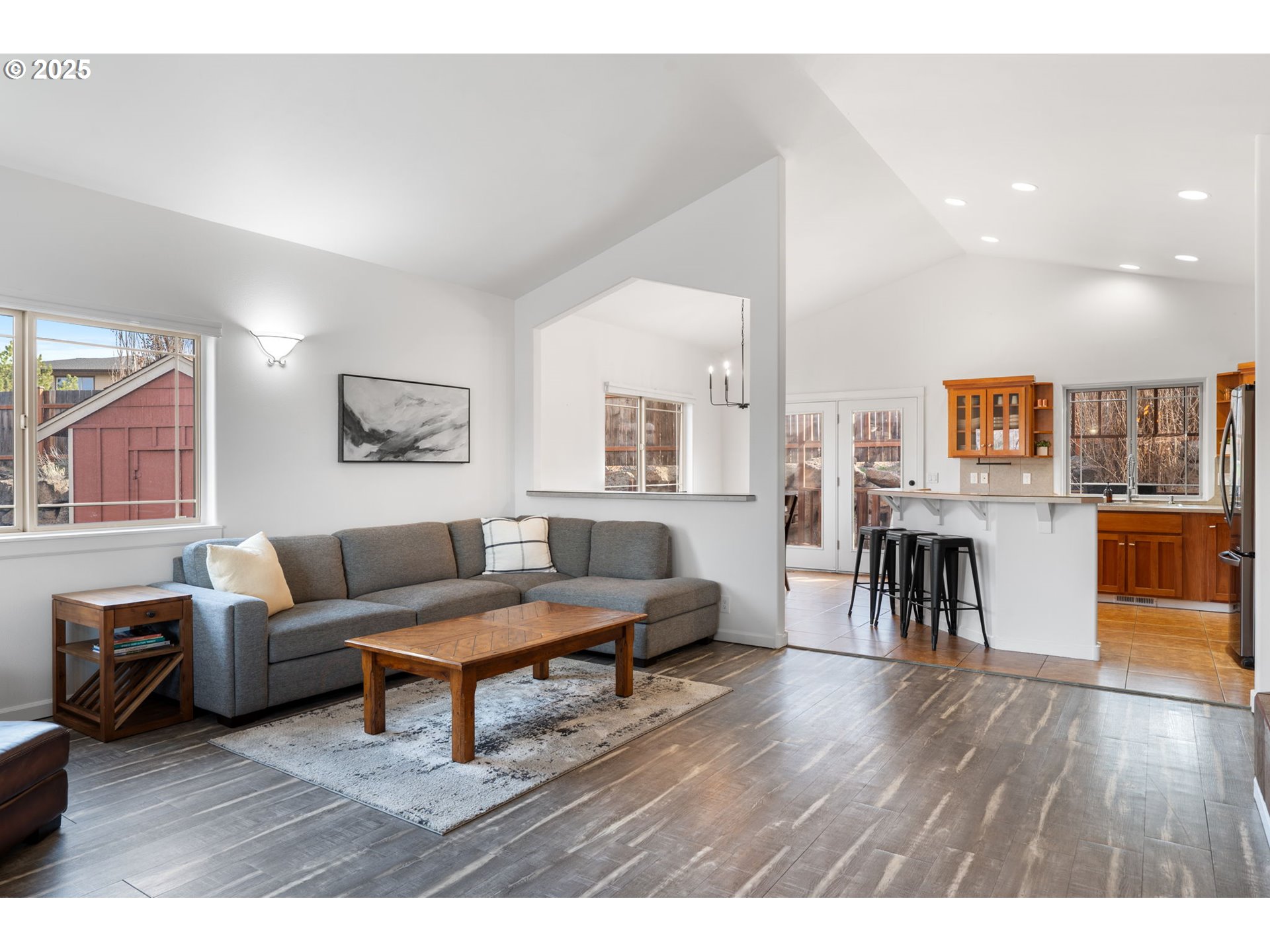 63103 Watercress Way Bend, OR 97701 - Photo 6 of 47 a living room with furniture and a wooden floor