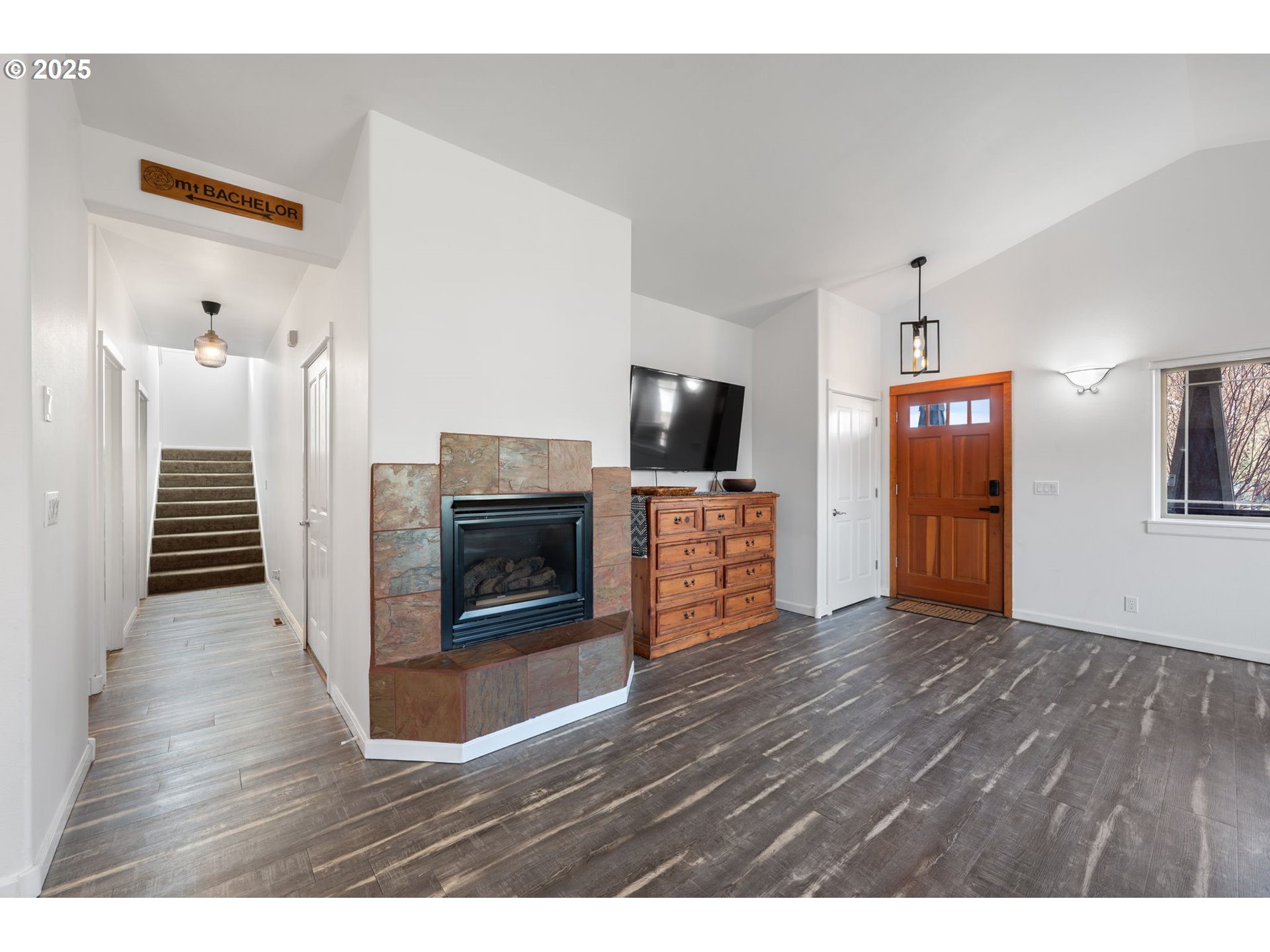63103 Watercress Way Bend, OR 97701 - Photo 7 of 47 a view of a livingroom with wooden floor