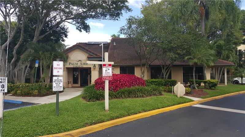 4541 West McNab Road, Unit 26 Pompano Beach, FL 33069 - Photo 2 of 12 a front view of house with yard and green space