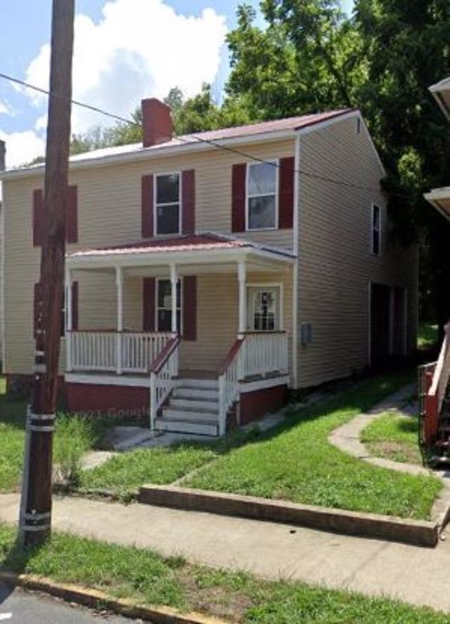 319 Roxbury Street Clifton Forge, VA 24422 - Photo 3 of 3 a front view of a house with a yard