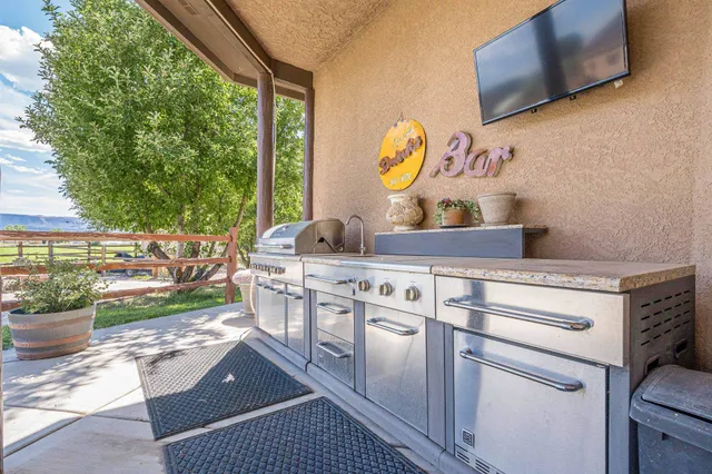 a view of a chairs and table in backyard