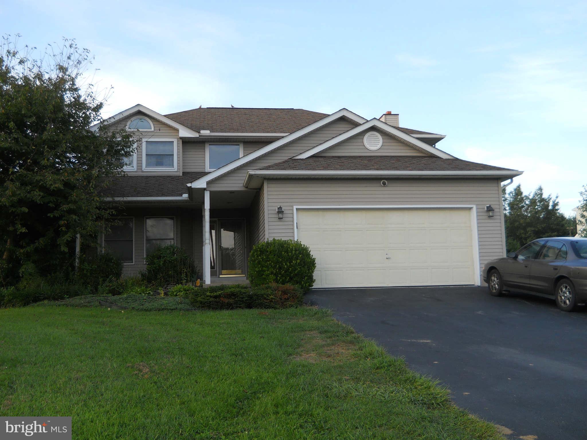 227 Hitching Post Drive Rising Sun, MD 21911 - Photo 1 of 26 a front view of a house with a yard and garage