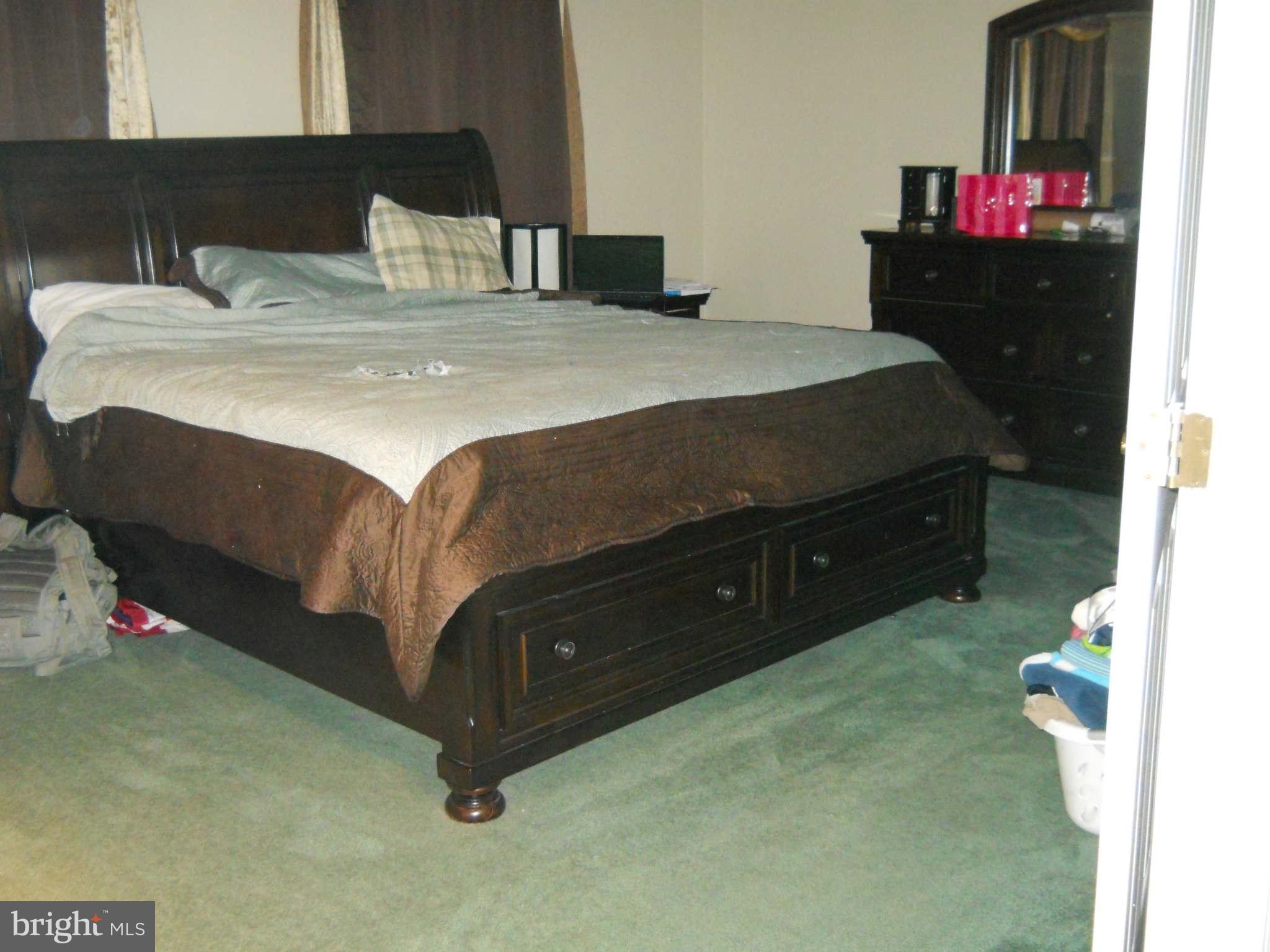 227 Hitching Post Drive Rising Sun, MD 21911 - Photo 17 of 26 a bedroom with a bed and a dresser