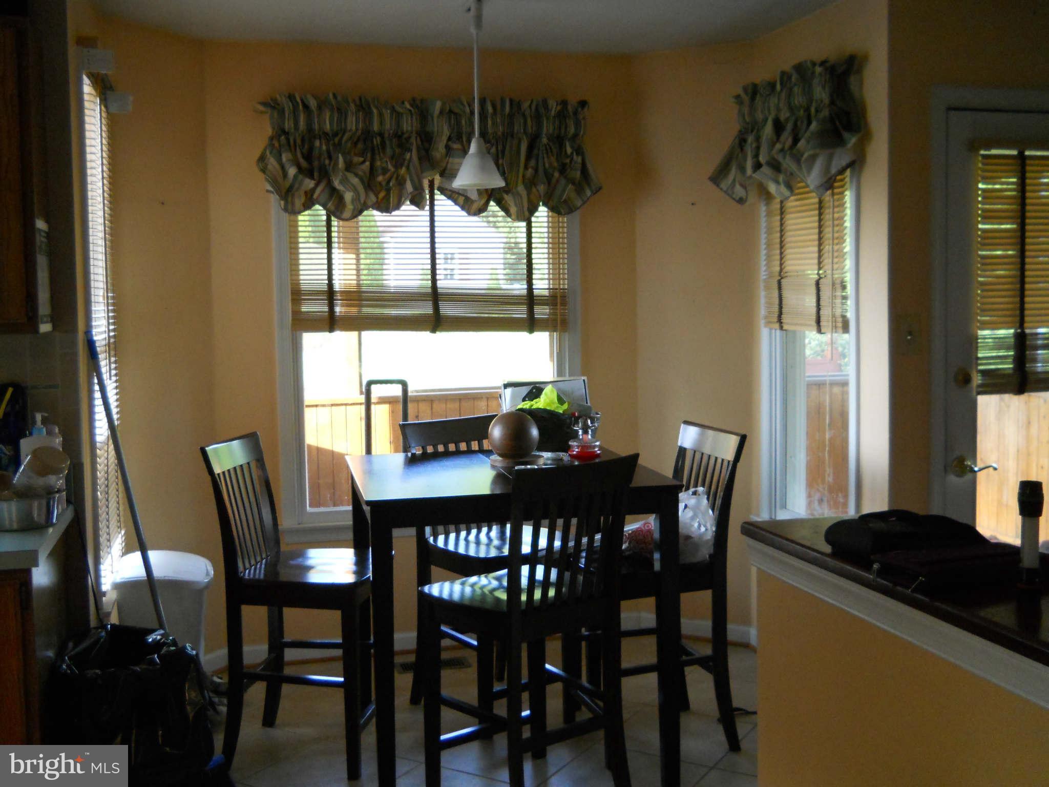 227 Hitching Post Drive Rising Sun, MD 21911 - Photo 7 of 26 a view of a dining room with furniture window and wooden floor