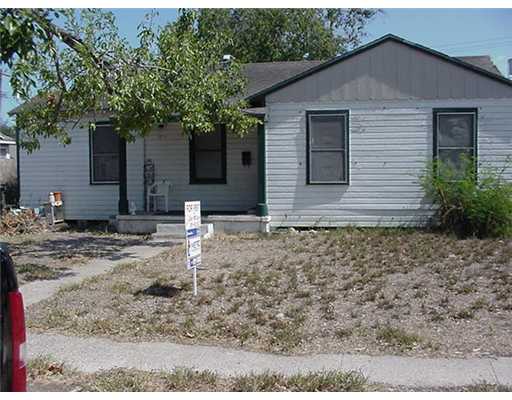 4214 Naples Street Corpus Christi, TX 78415 - Photo 1 of 1 a backyard of a house with large trees and wooden fence