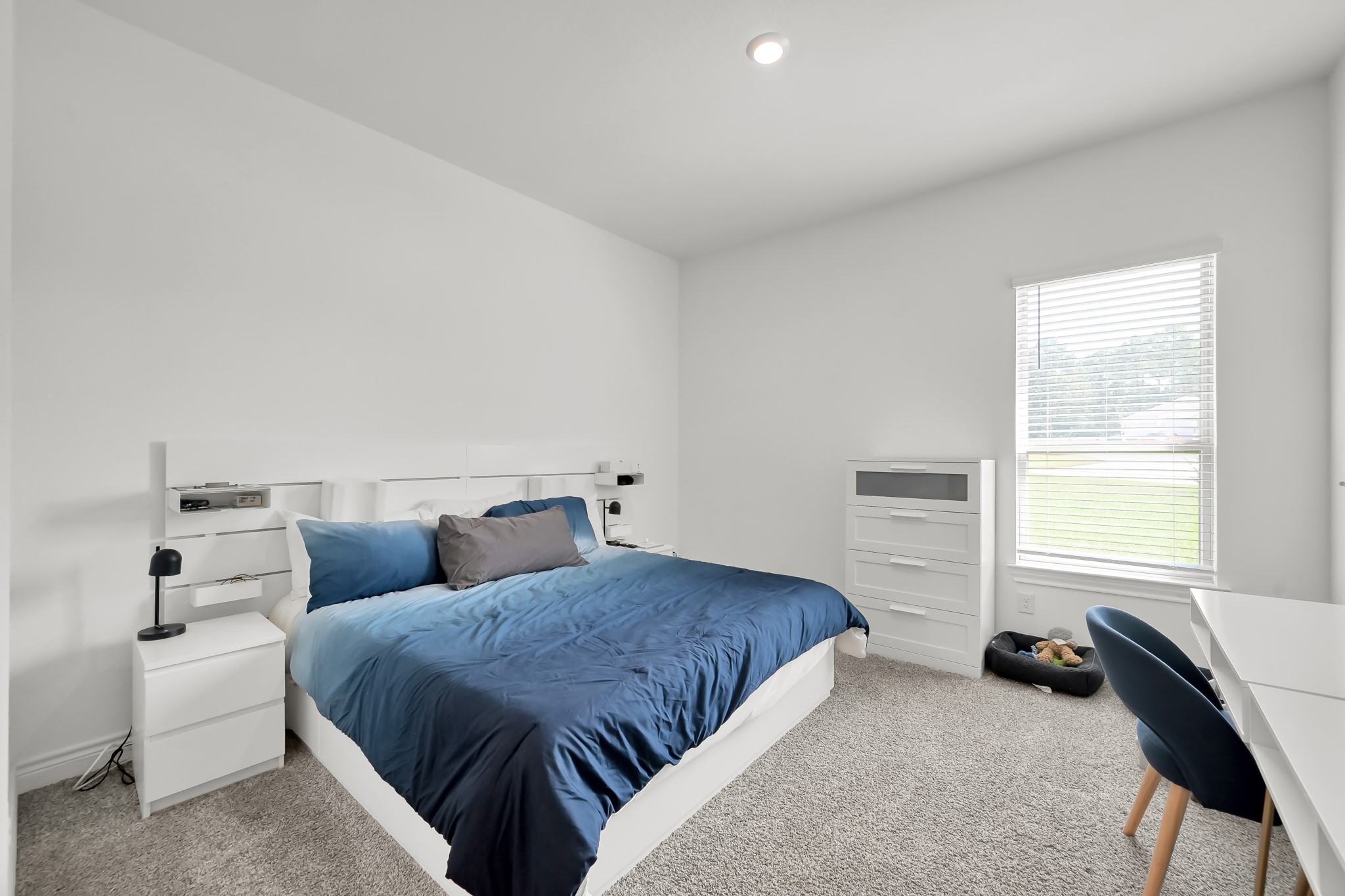 12250 Seagrape Lane Conroe, TX 77304 - Photo 13 of 19 a bedroom with bed and a window