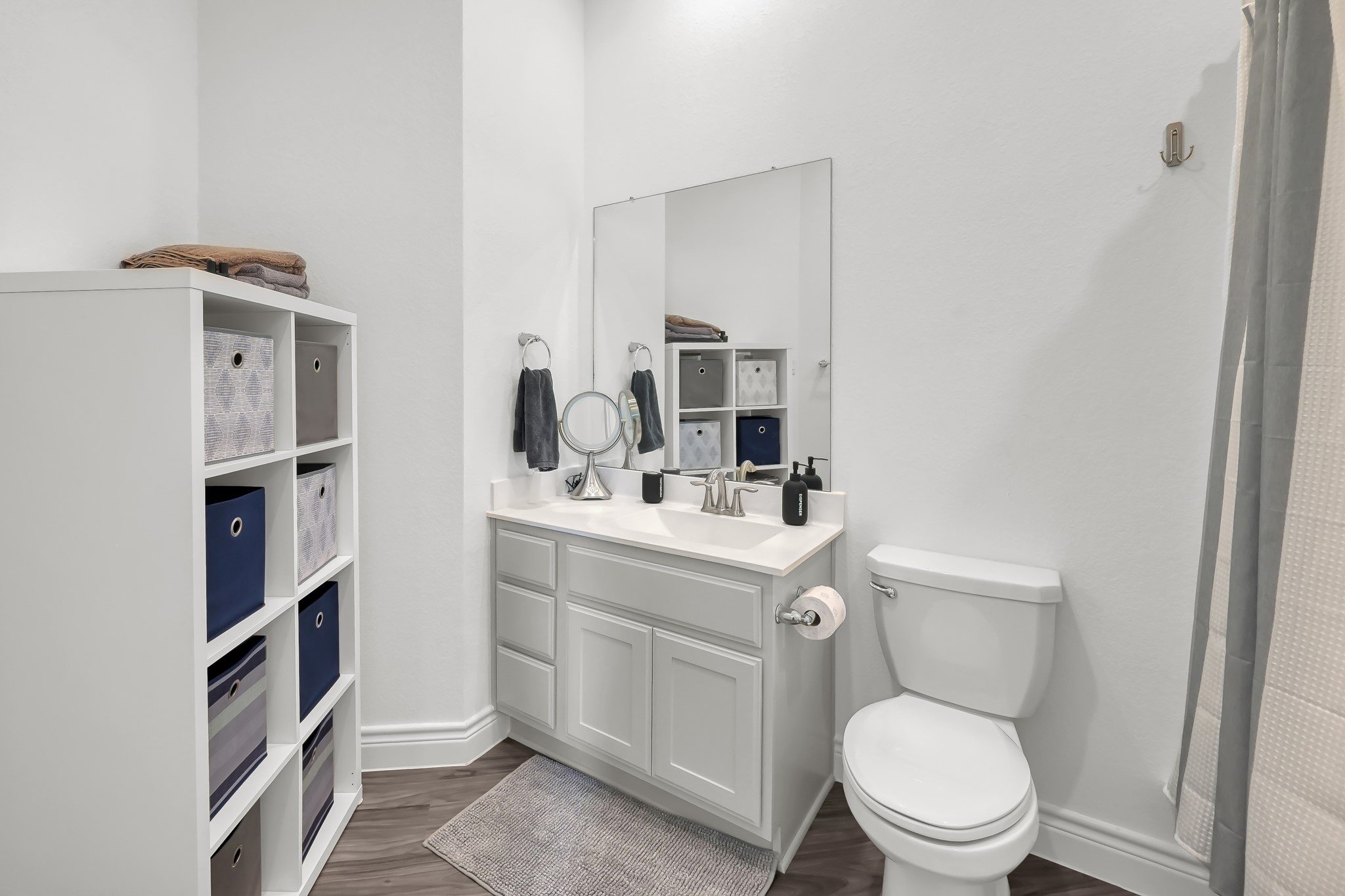 12250 Seagrape Lane Conroe, TX 77304 - Photo 14 of 19 a bathroom with a toilet sink and mirror