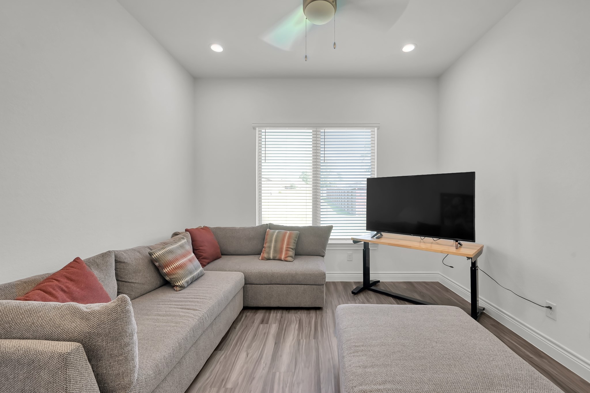 12250 Seagrape Lane Conroe, TX 77304 - Photo 15 of 19 a living room with furniture and a flat screen tv