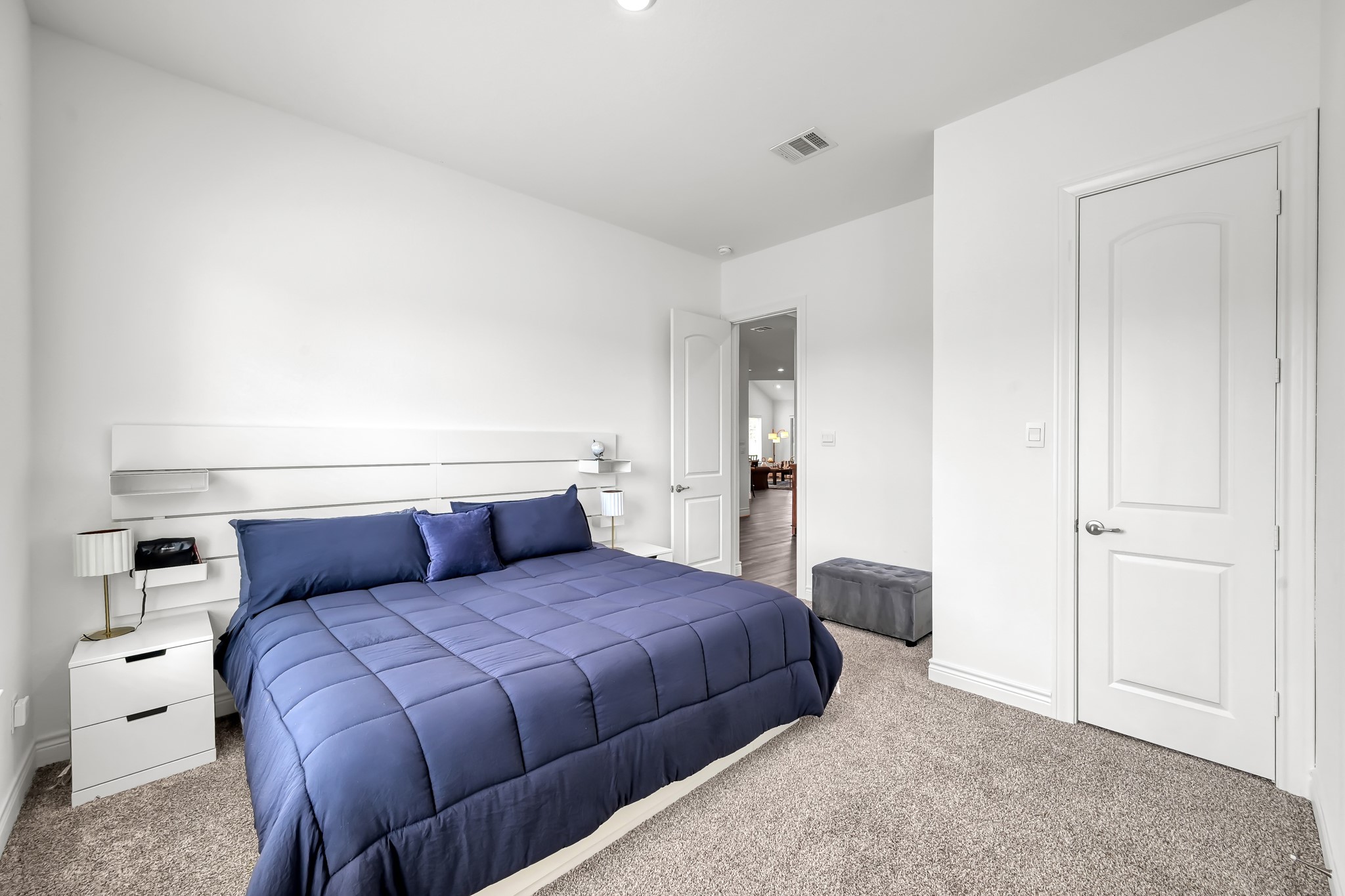 12250 Seagrape Lane Conroe, TX 77304 - Photo 16 of 19 a bedroom with a large bed and a closet