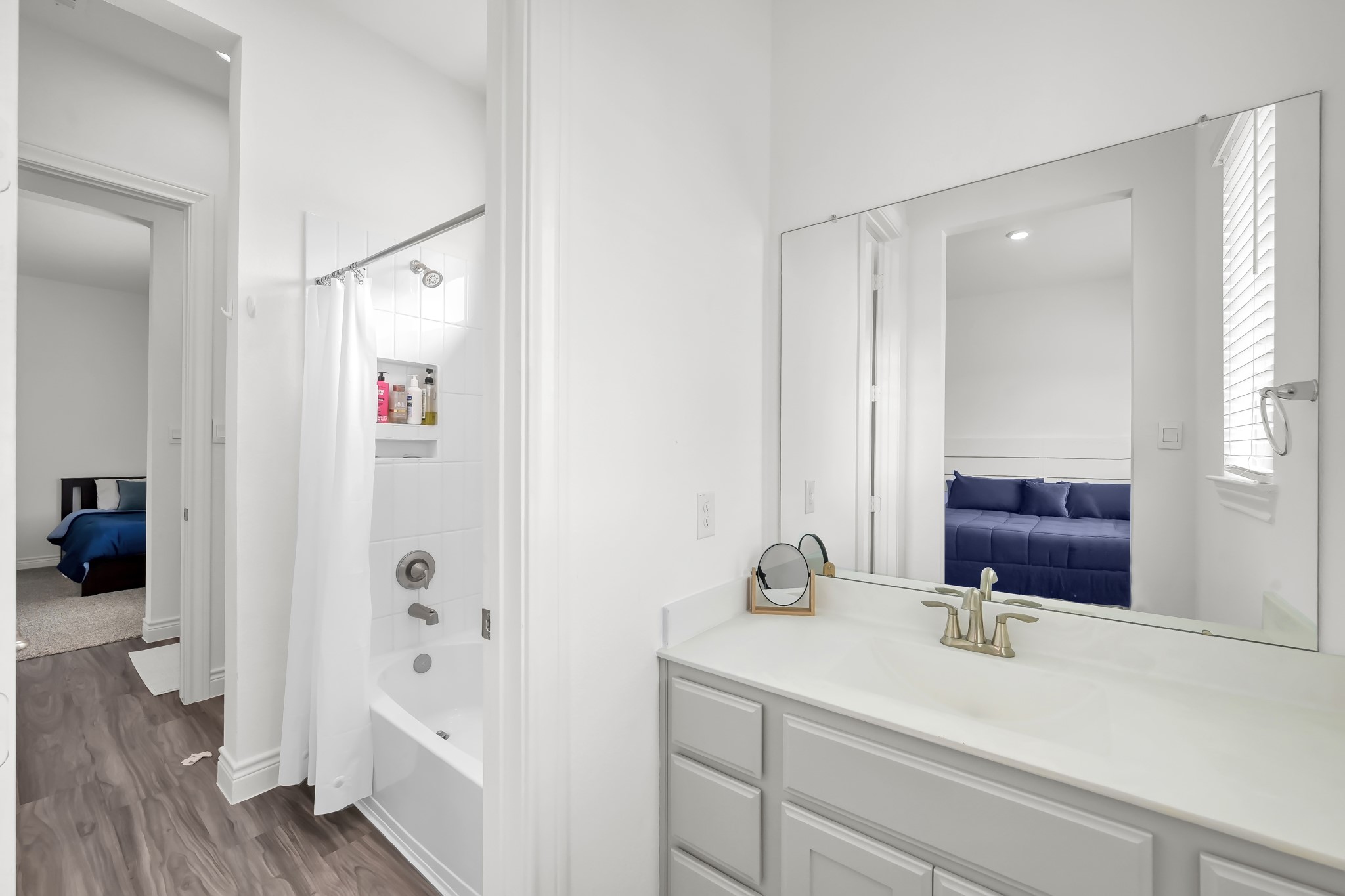12250 Seagrape Lane Conroe, TX 77304 - Photo 17 of 19 a bathroom with a sink and a mirror