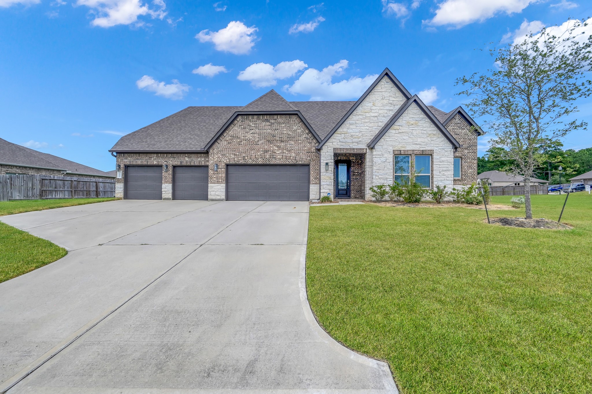 12250 Seagrape Lane Conroe, TX 77304 - Photo 2 of 19 a view of a house with a yard