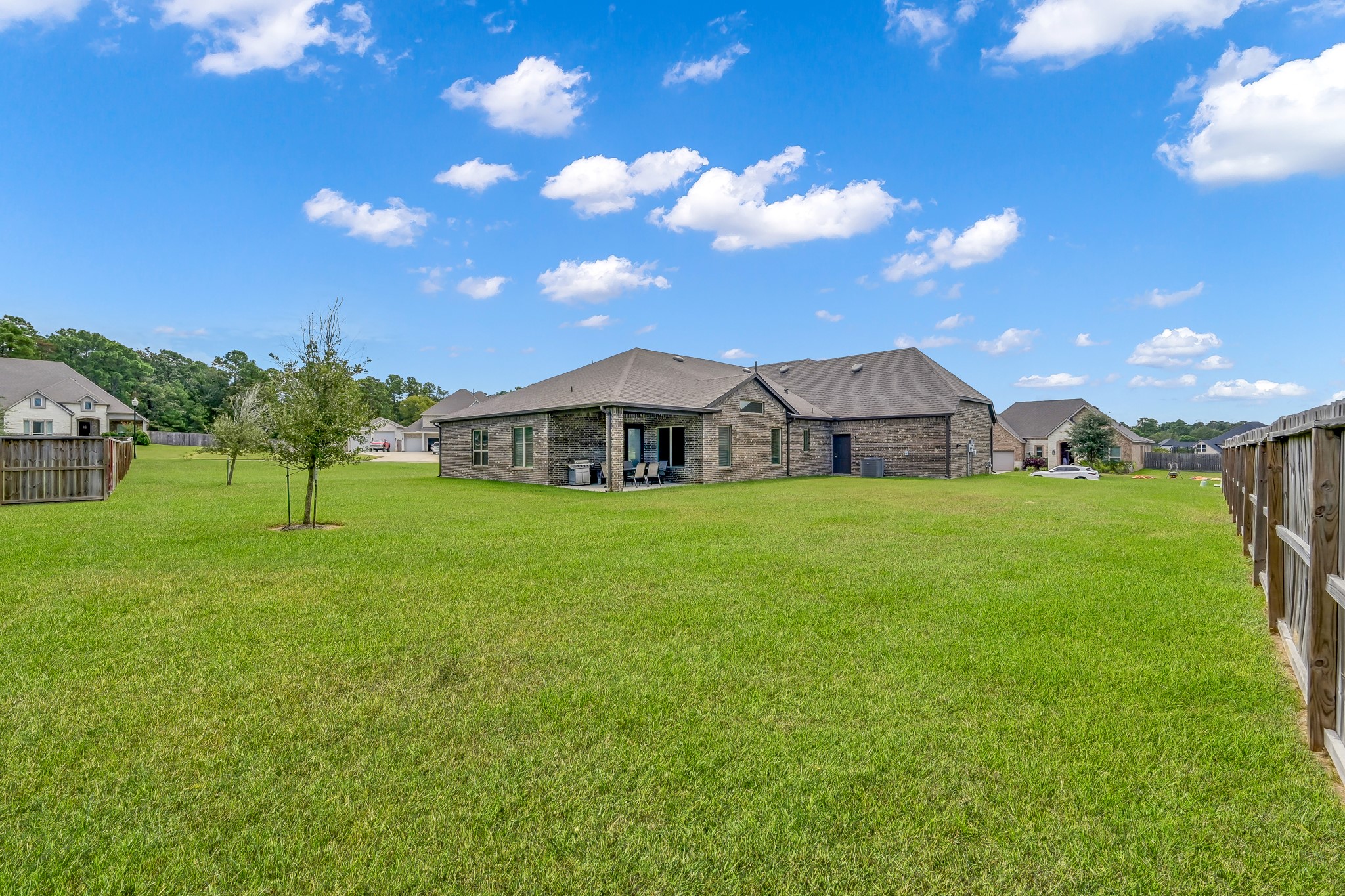 12250 Seagrape Lane Conroe, TX 77304 - Photo 3 of 19 a front view of house with yard and green space